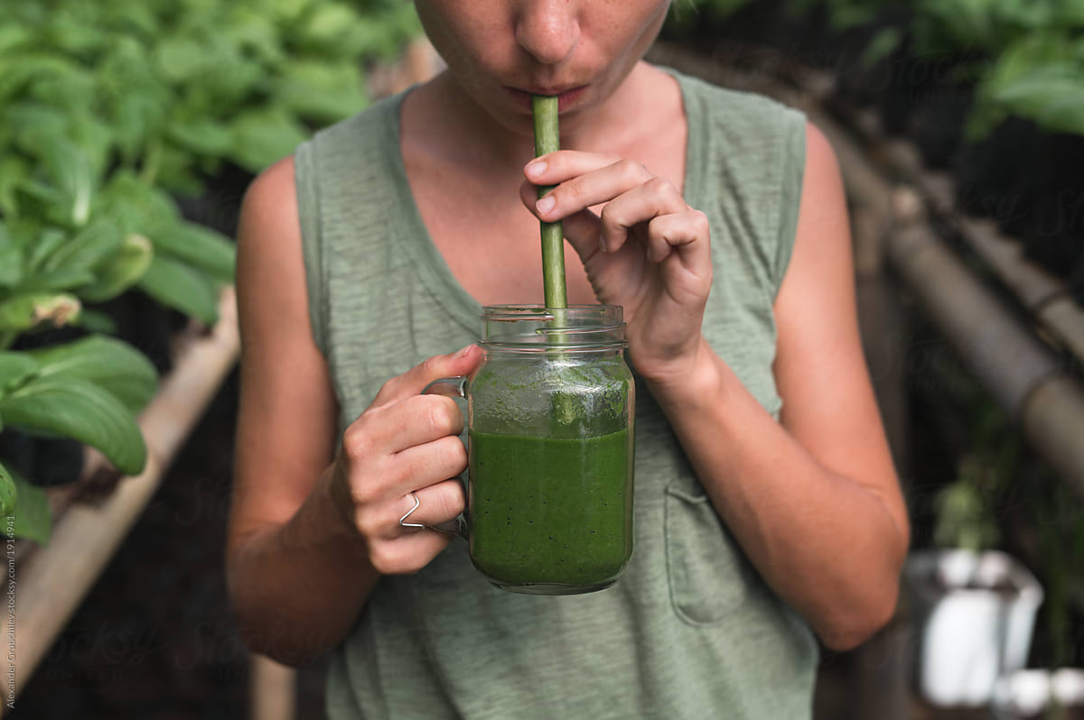 Woman Drinks Green Juice