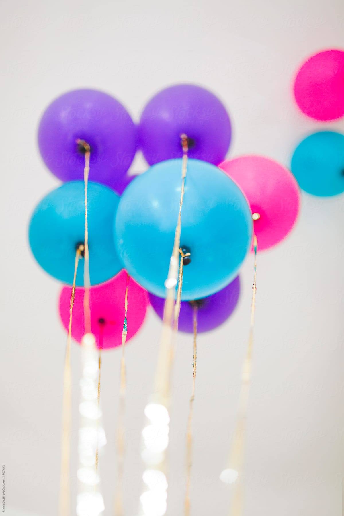 Flying Balloons And Gold Strings by Stocksy Contributor Laura Stolfi -  Stocksy