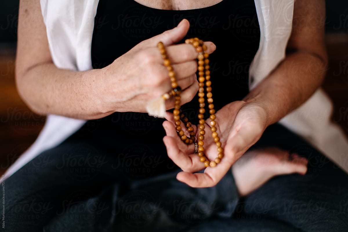 Woman holding Prayer Beads