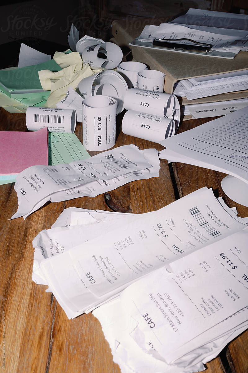 Cluttered Desk with Business Receipts and Documents