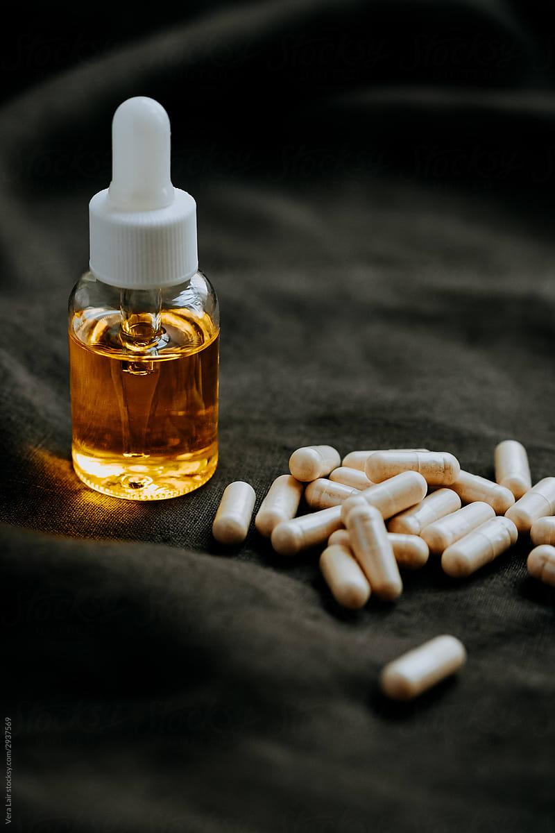 Essential Oil Bottle and nutritional pills