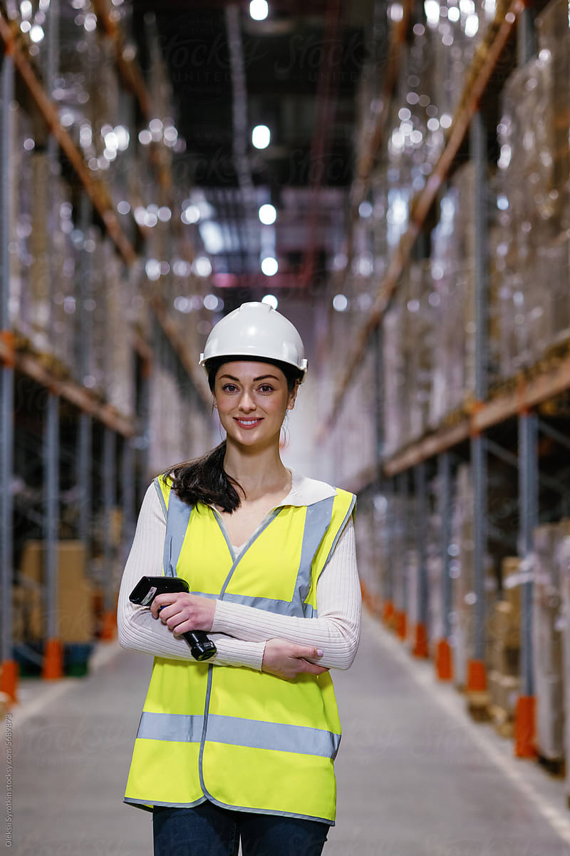 Female storage worker holding scanner