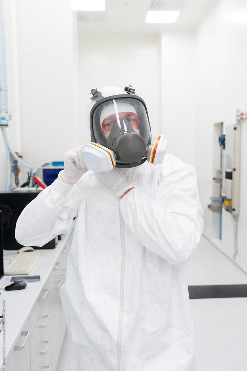 Scientist Putting Helmet At Clean Room