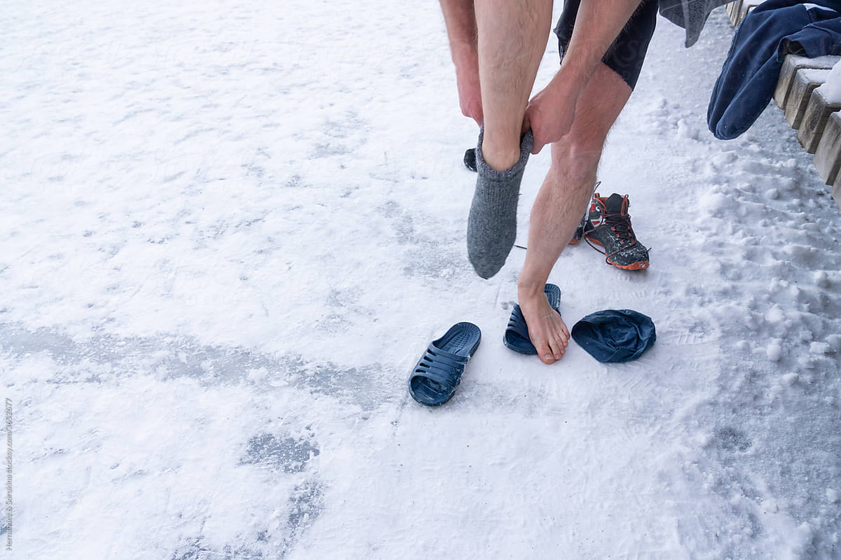 Man Put On Warm Socks Outdoors
