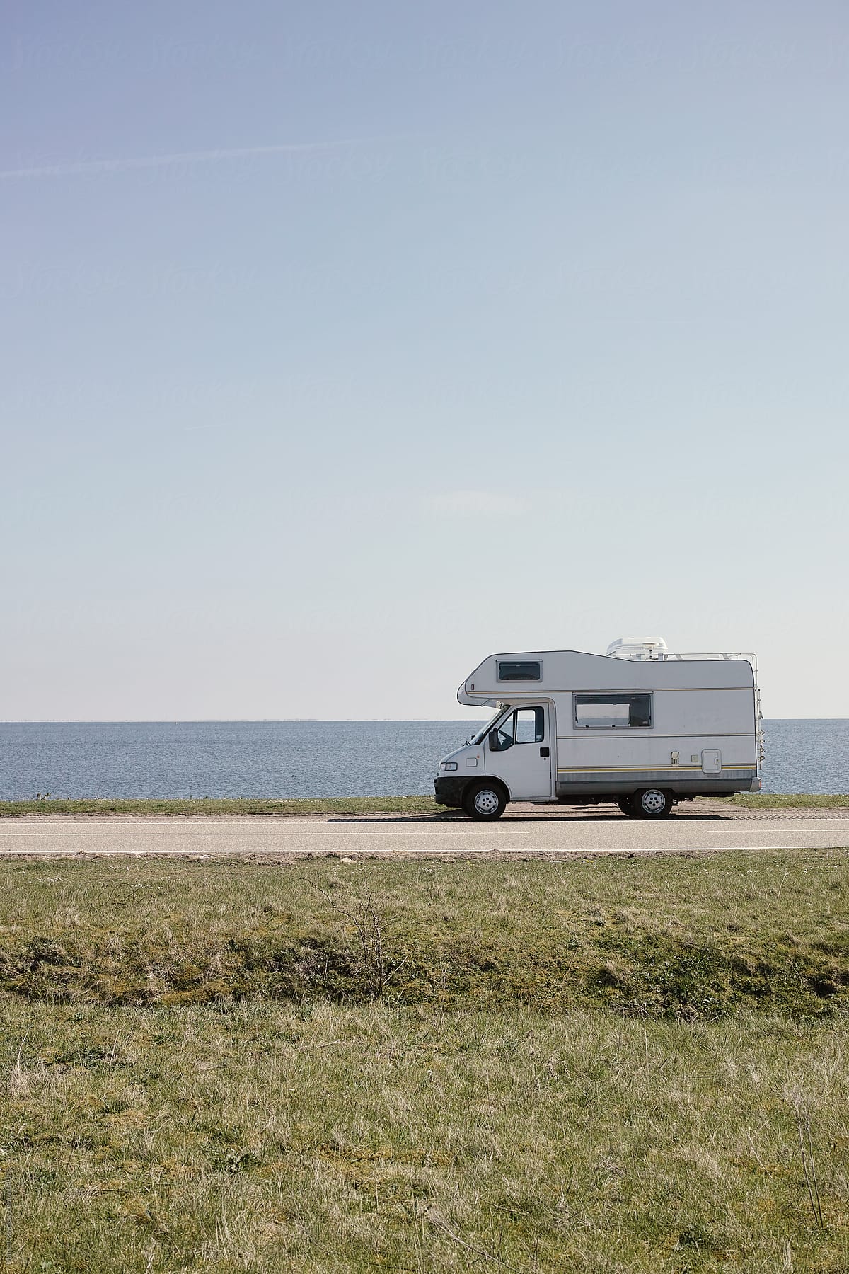 Campercar parked at sea in The Netherlands