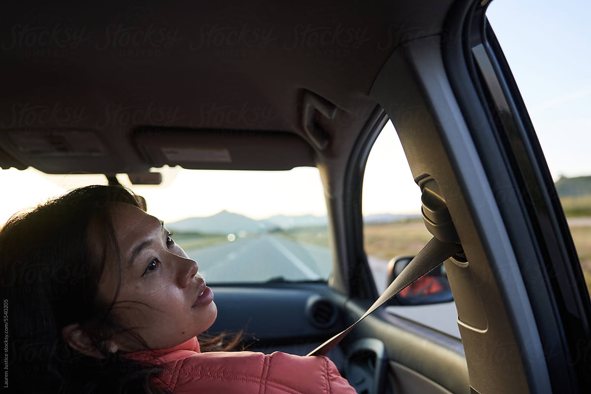 South east asian girl in passenger seat