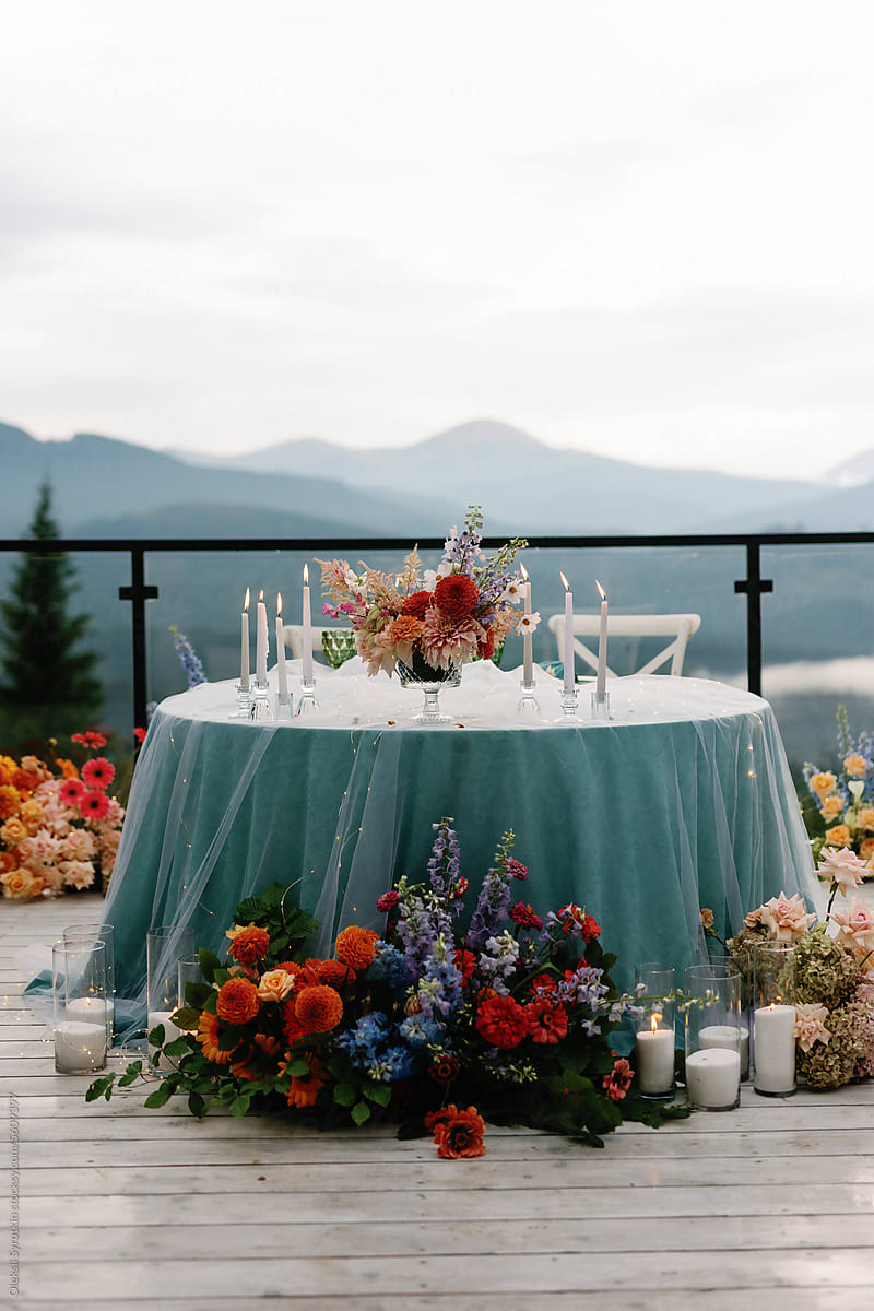 Mountain massif ceremonial dinner table floral light setting reception