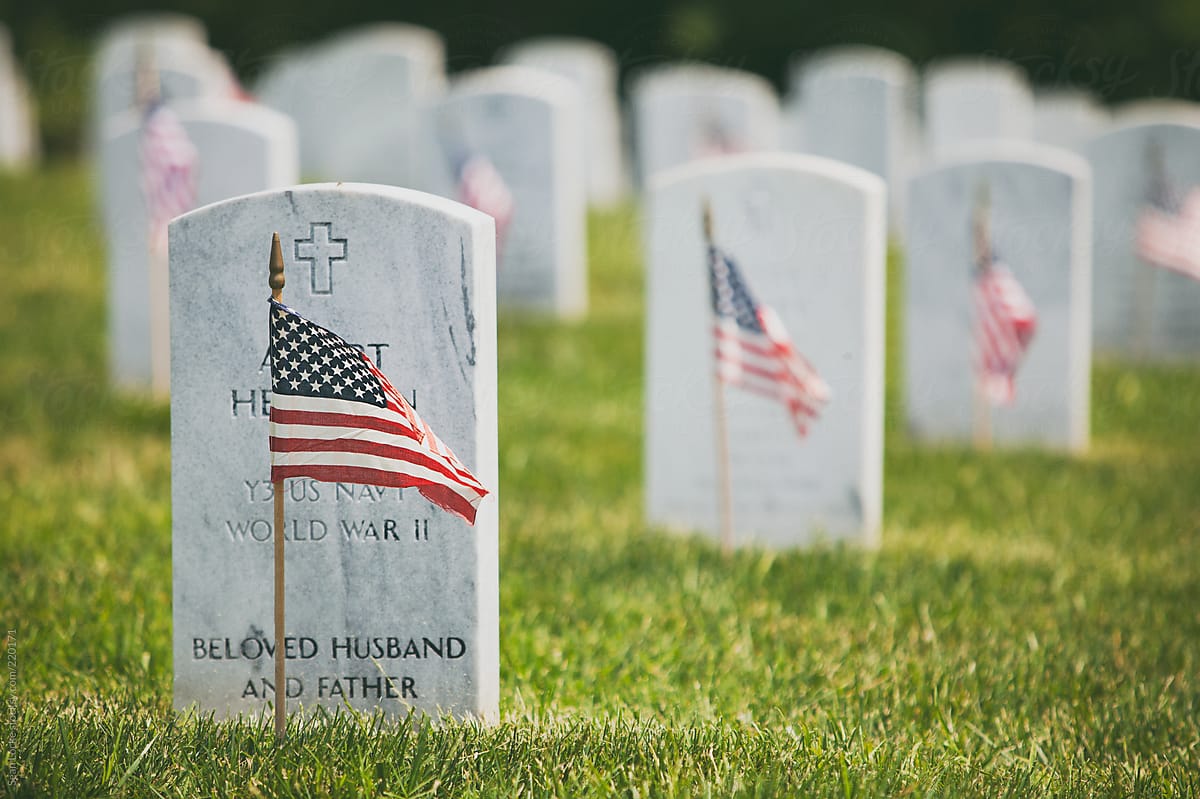 Memorial: Flags Placed In Front Of Military Headstones