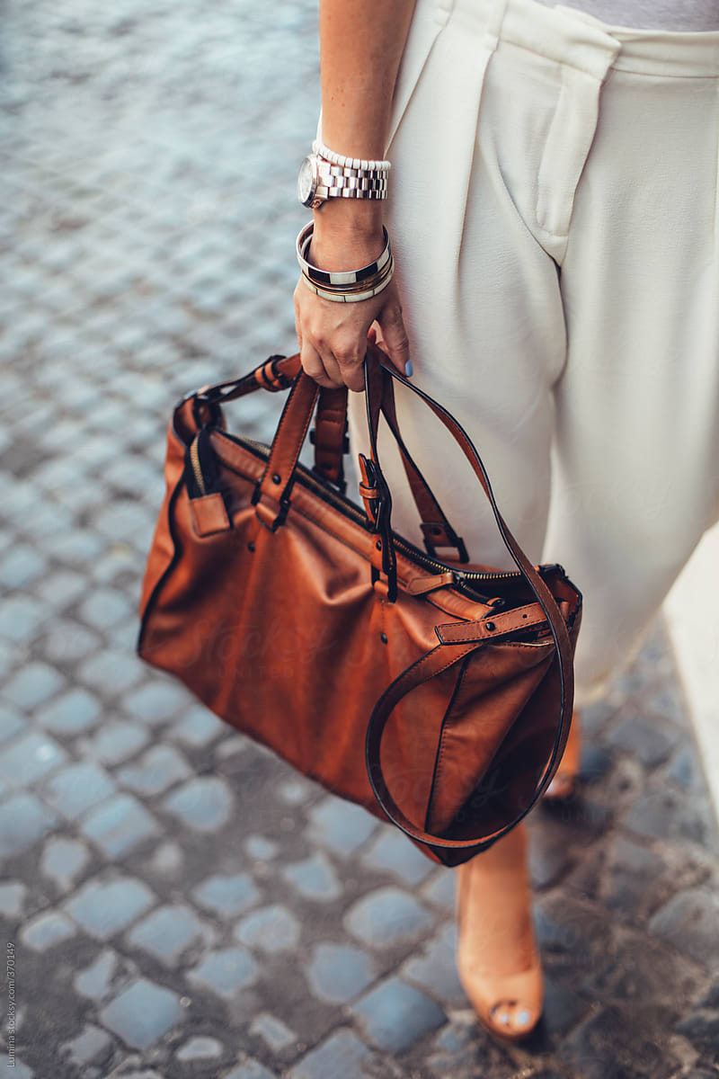 Woman Carrying a Brown Leather Handbag