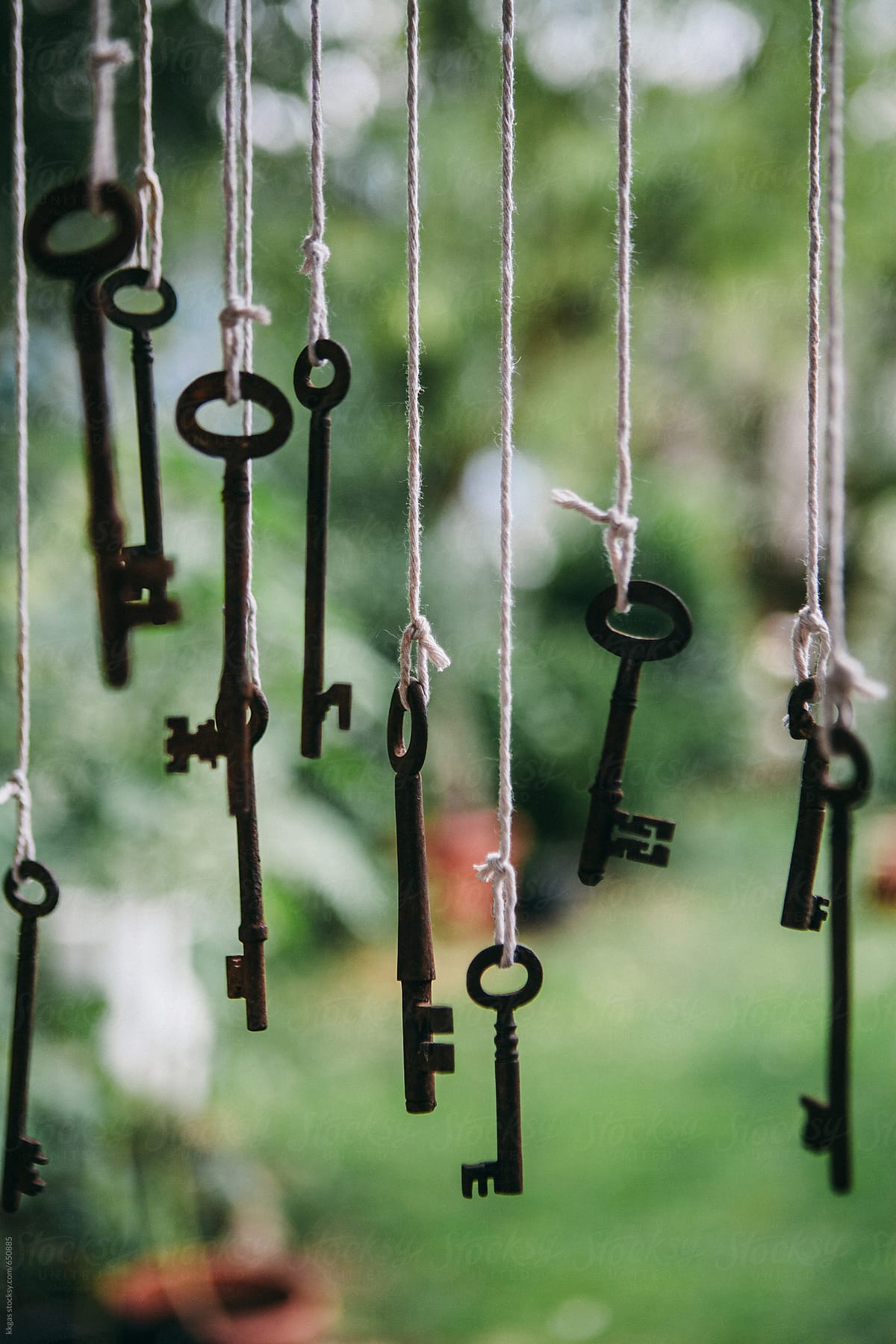 Antique keys hanging outdoors.