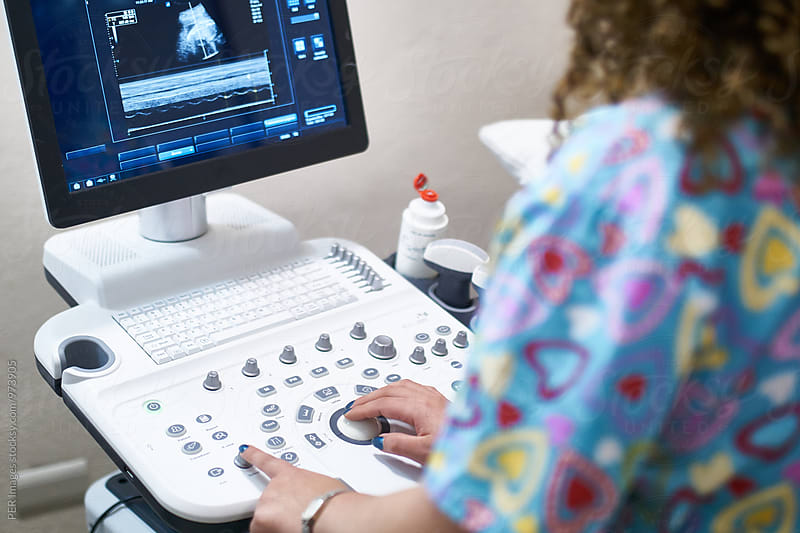 Medical technician working with an ultrasound machine