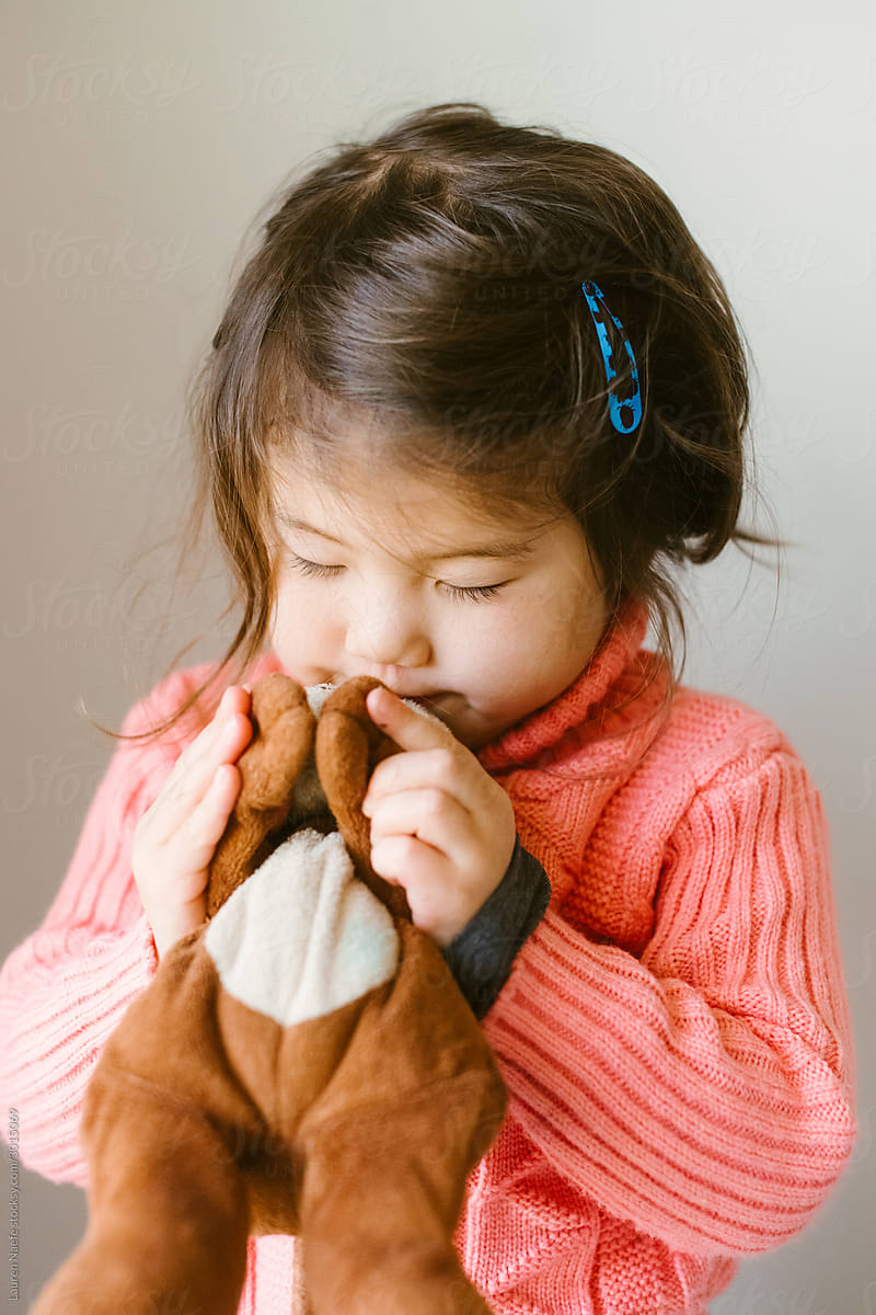 Little girl and stuffed animal