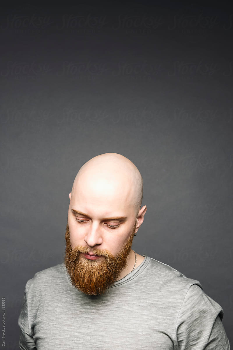 Portrait Of Bald Man With Red Beard Looking Down Del Colaborador De