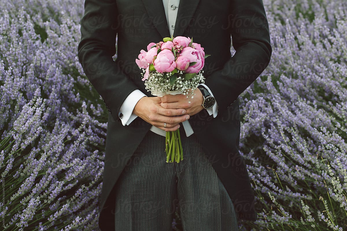 Groom with wedding bouquet