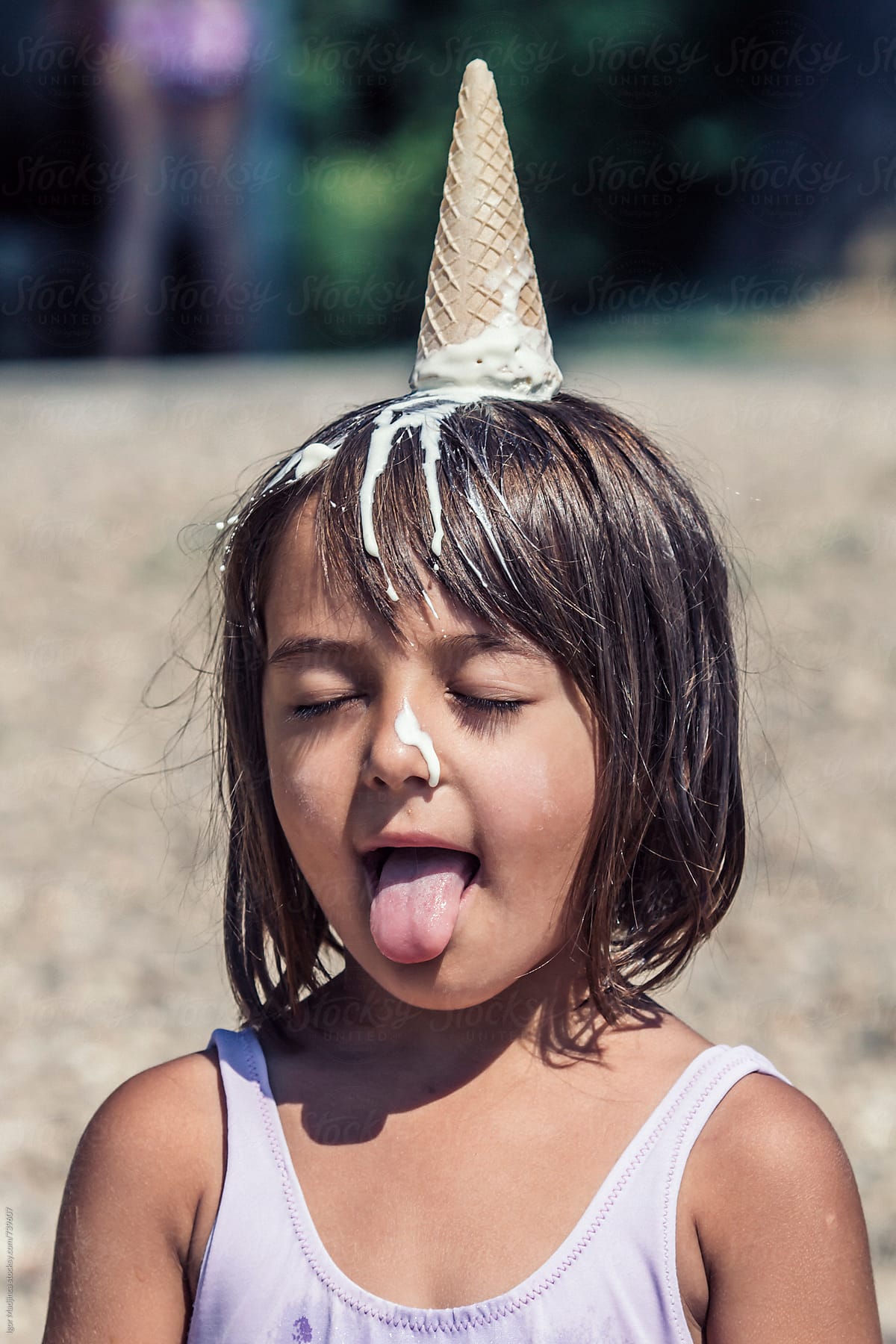A New Way Of Eating Ice Cream Girl With Melted Ice Cream On Her Head By Stocksy Contributor