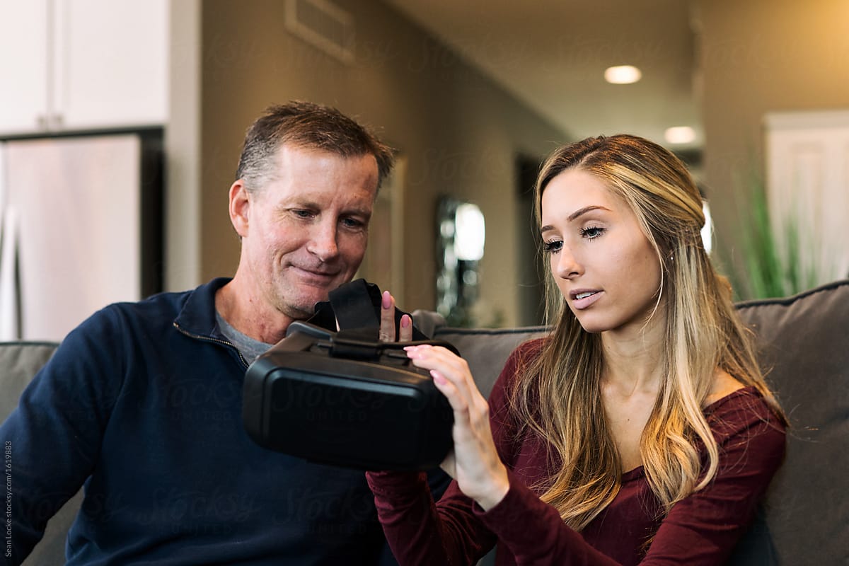 Home: Father Is Shown How To Wear VR Headset