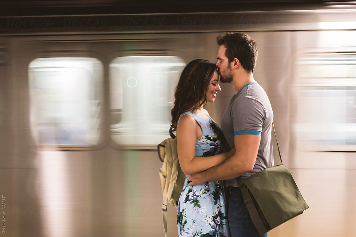 Couple Kissing Against Subway By Stocksy Contributor Simone Wave