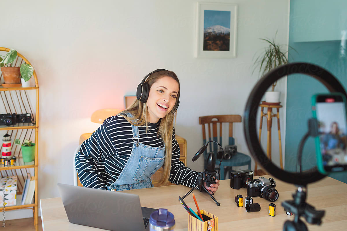 A woman laughing while working