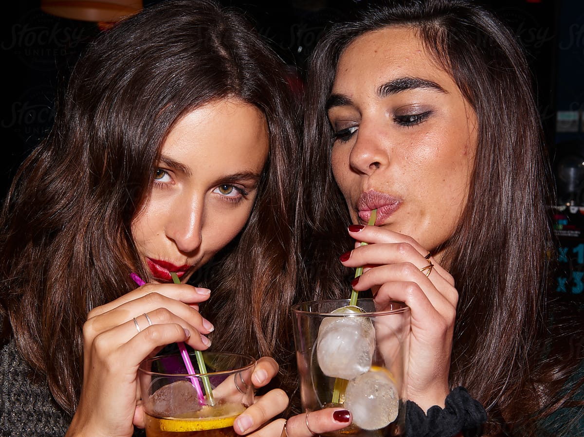 women having cocktails in bar