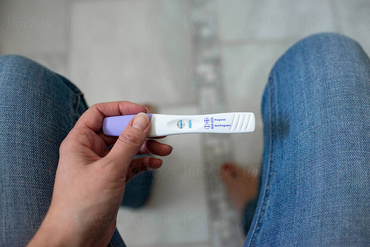 POV View of Woman Holding a Positive Pregnancy Test