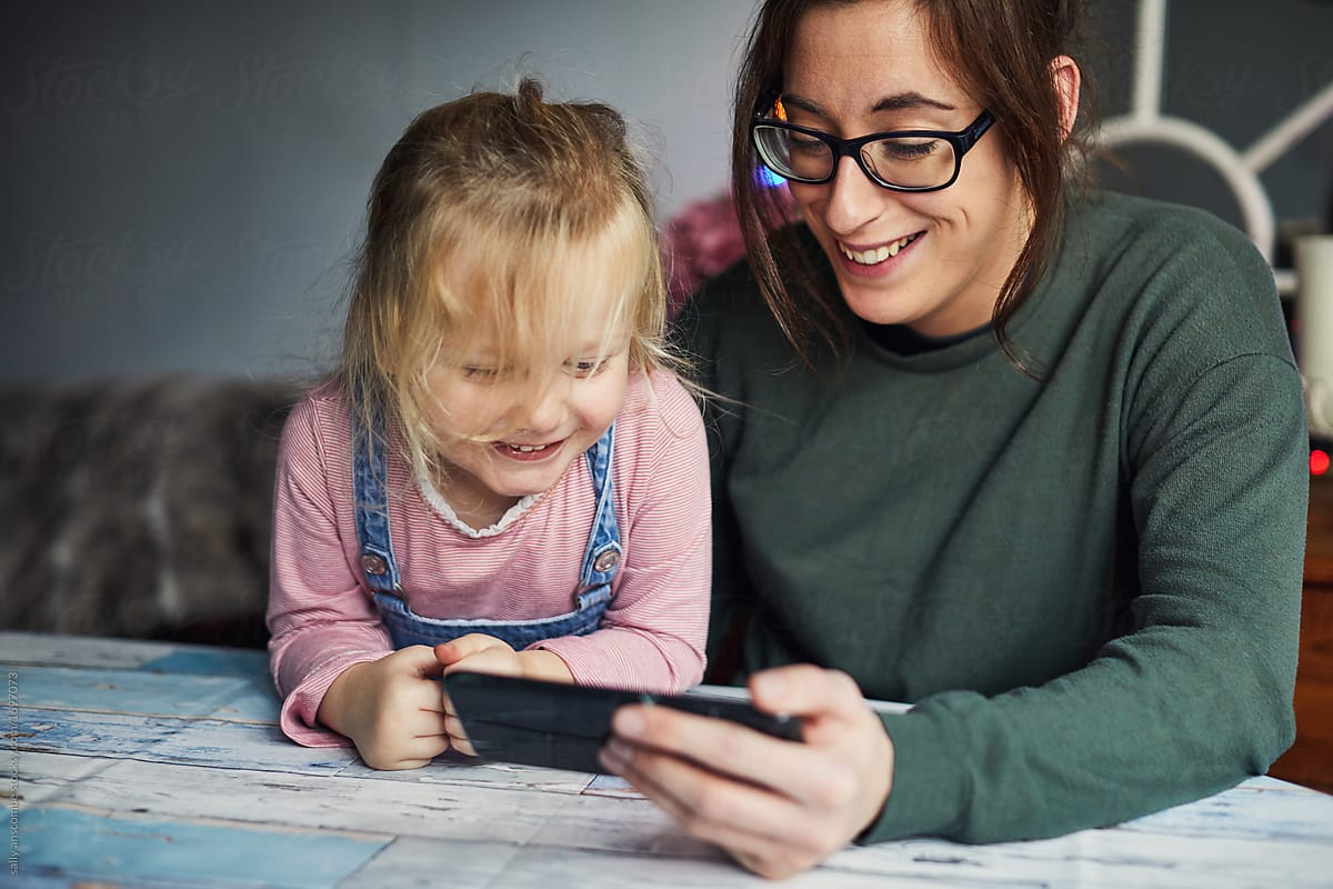 Woman and child using a smart phone