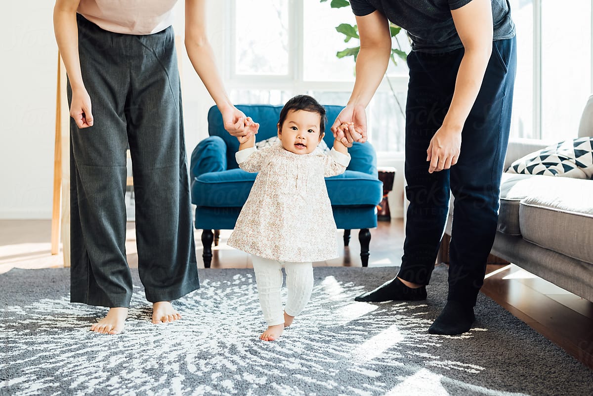 Adorable girl with her parents indoors