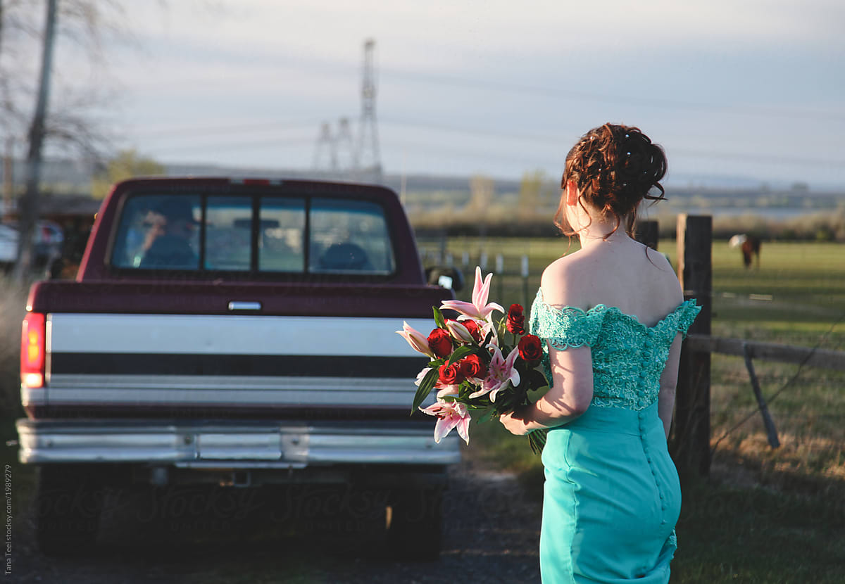 teenage couple having fun on way to high school prom