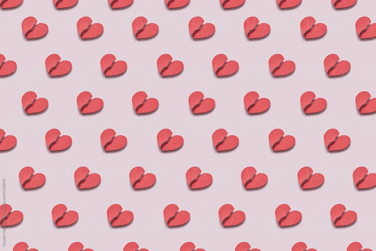 Pattern of repeated torn red paper hearts.