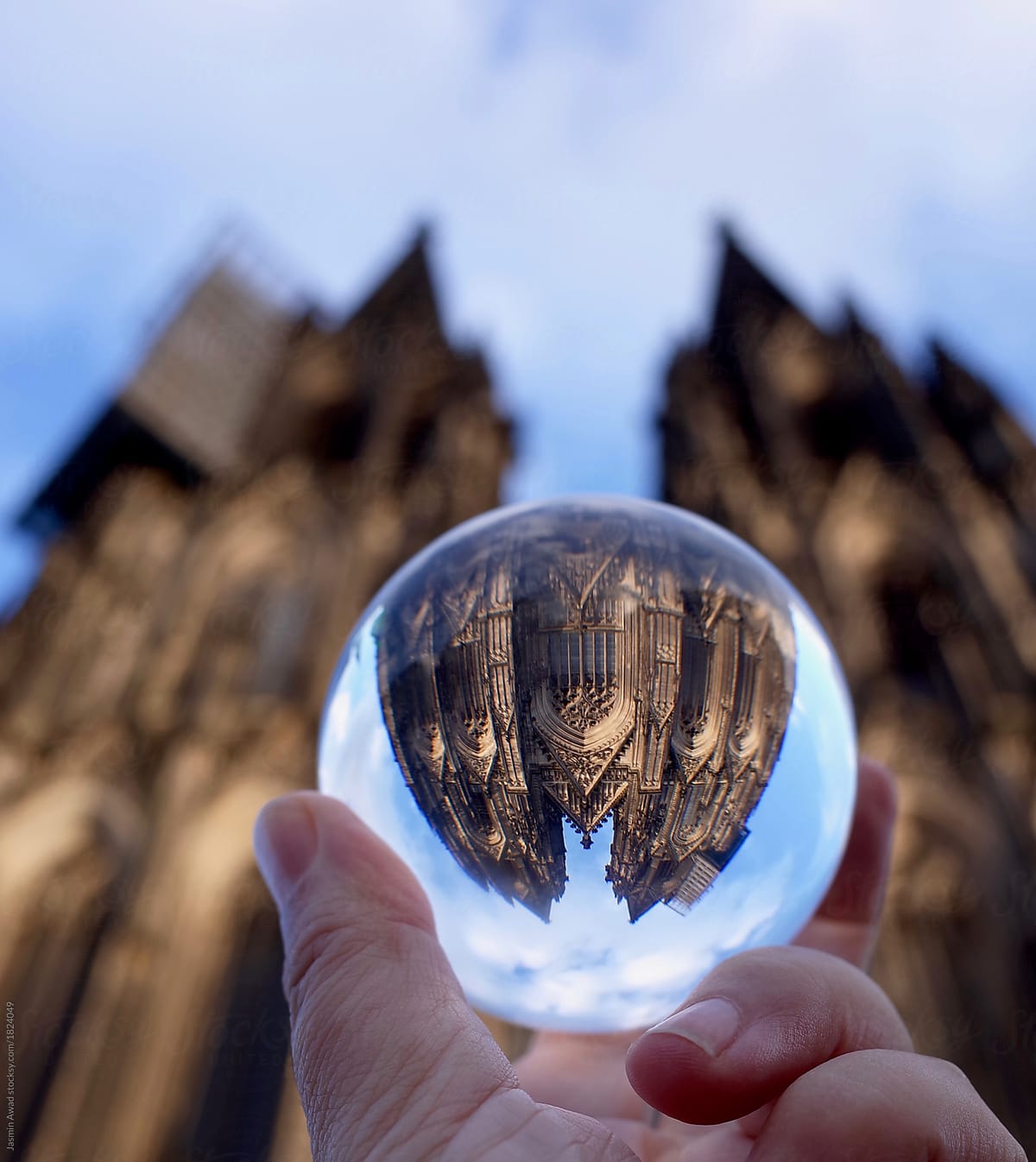 Cologne Cathedral reflected upside down in glass sphere