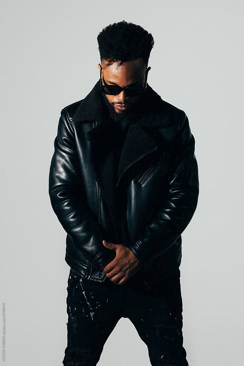 Confident black man in leather jacket