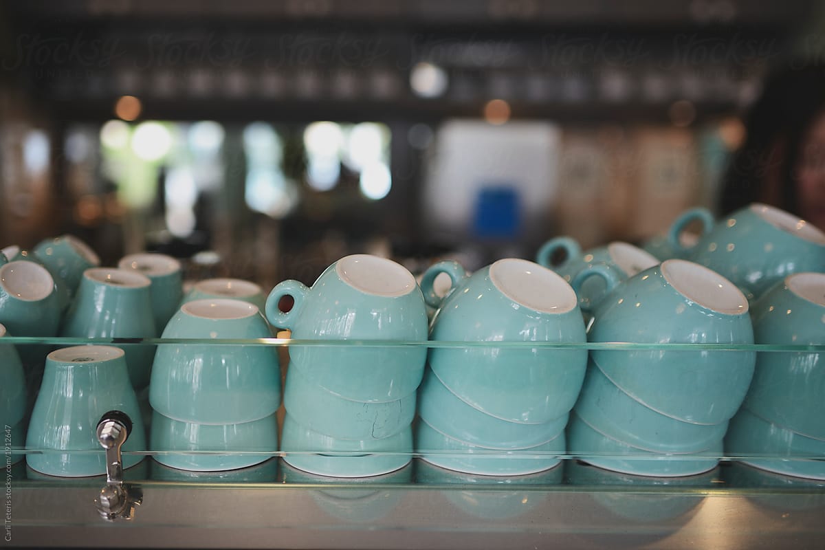 Stacks Of Empty Coffee Cups On Top Of An Industrial Espresso Machine In A  Cafe by Stocksy Contributor Carli Teteris - Stocksy