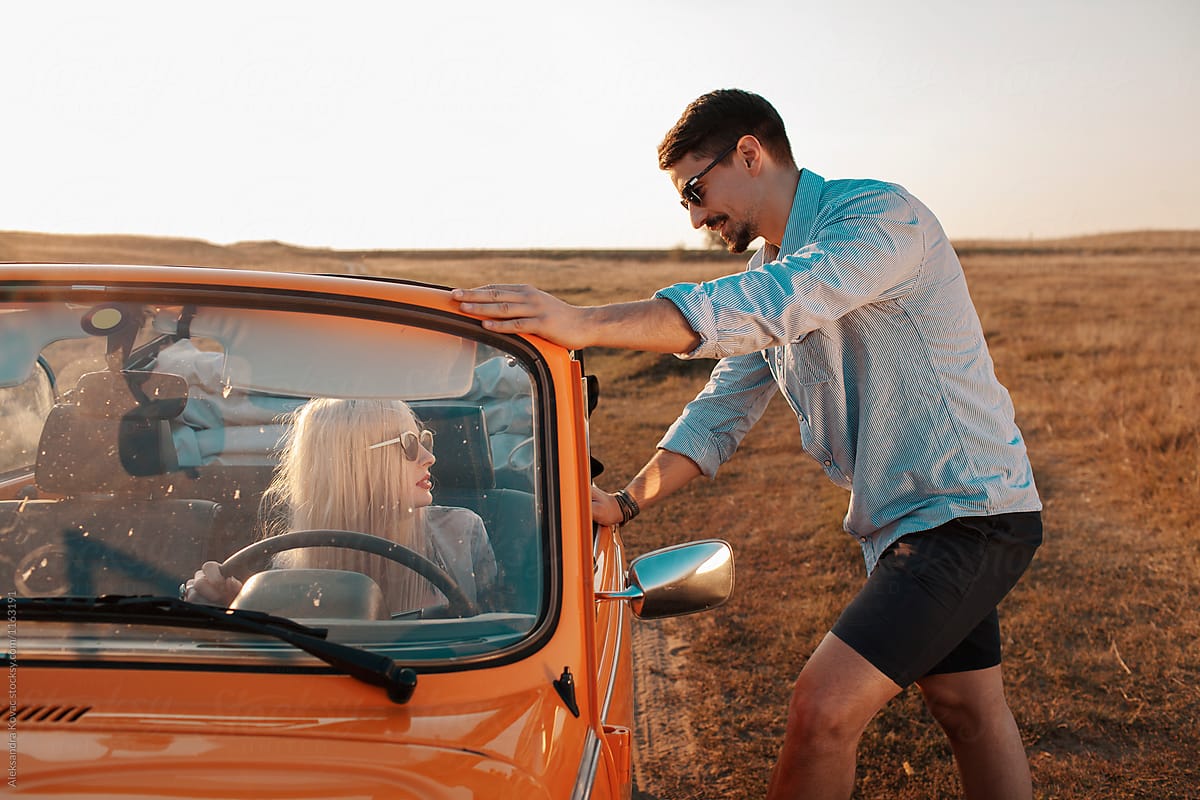 Couple On Road Trip In Convertible Car At Vast Land By Stocksy Contributor Alexandra Bergam 