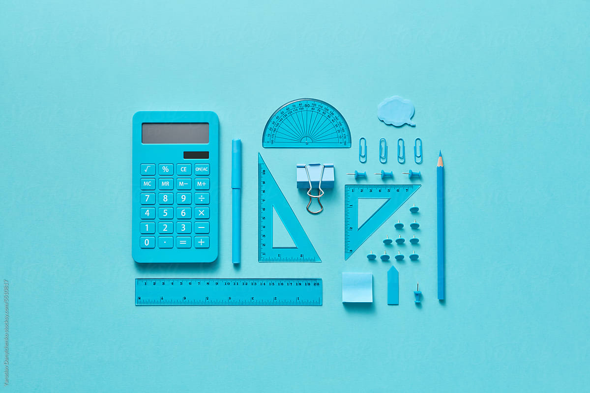 Minimalist flat lay of stationery items in blue tones.