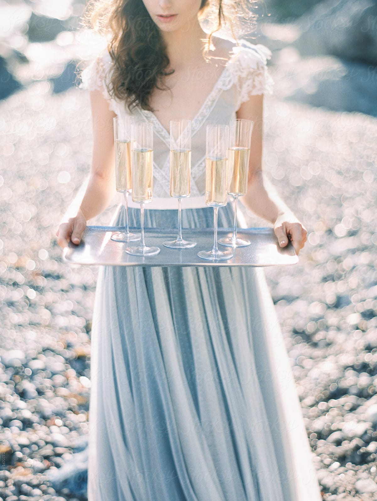 Woman Holding Tray With Champagne Glasses By Stocksy Contributor Julia K Stocksy