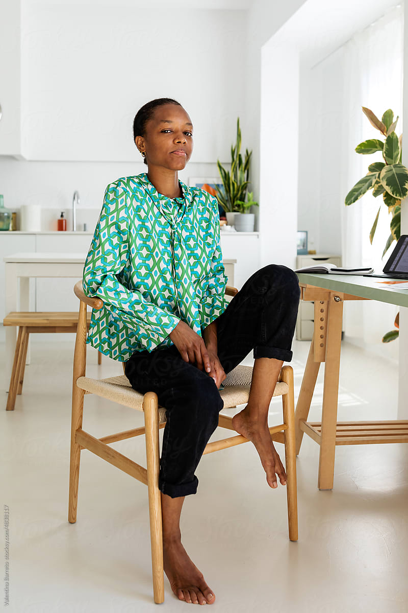 Chic African freelance woman at home
