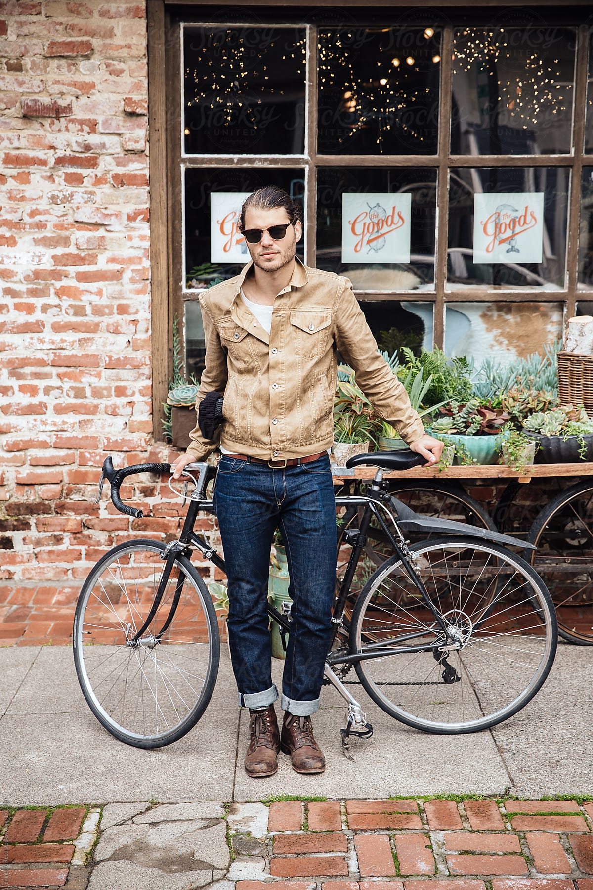 Hipster millennial on bike in urban area