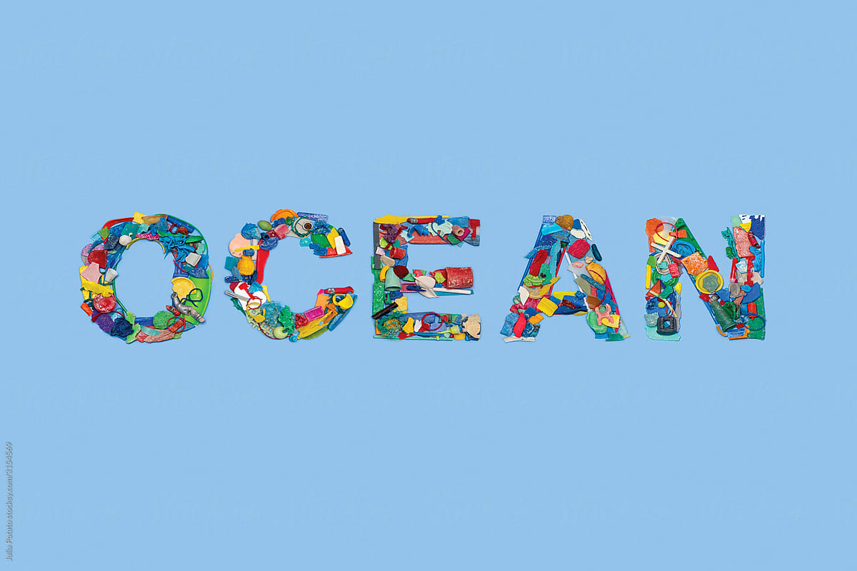 Pieces of colourful plastic in form of word OCEAN