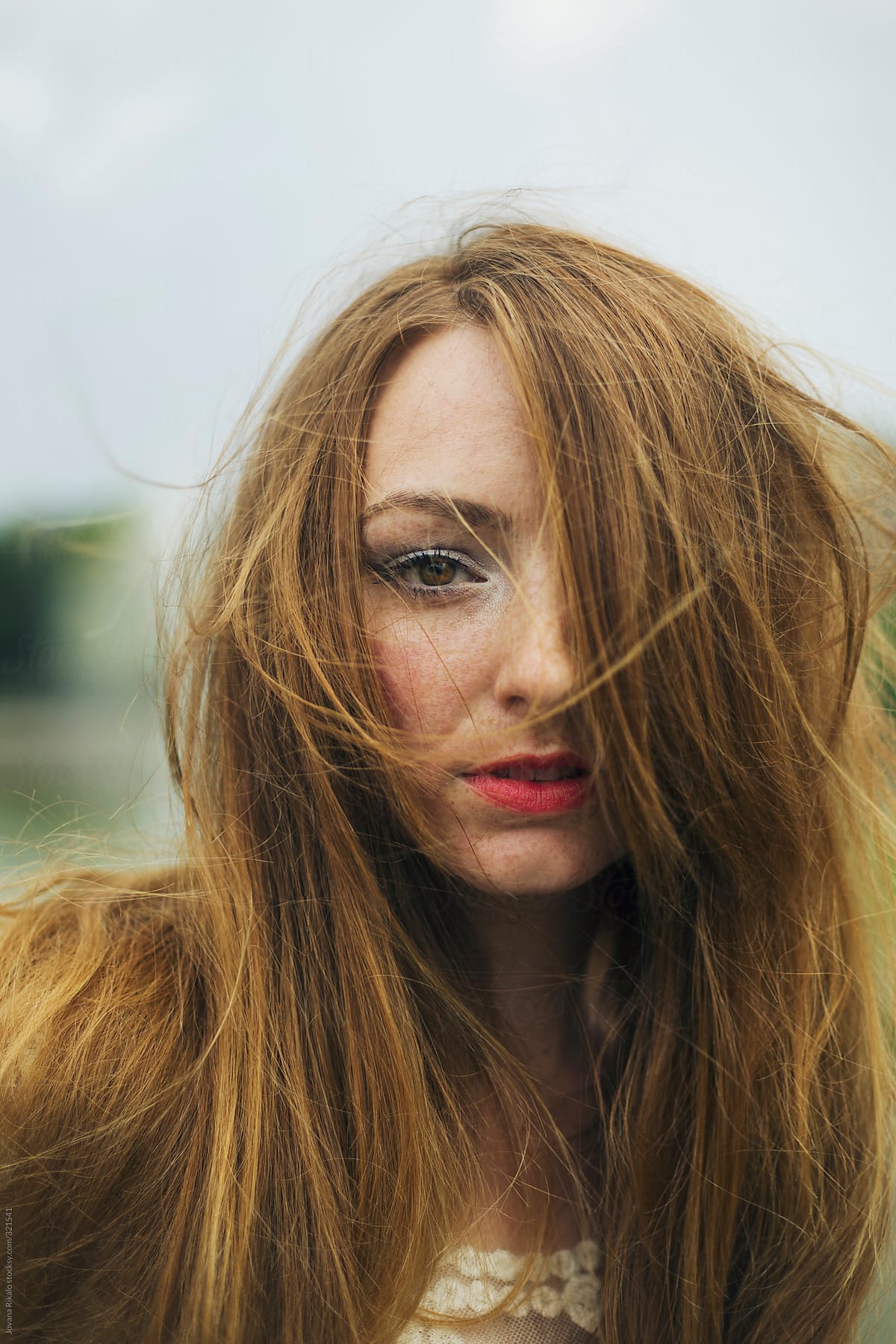 Portrait Of A Beautiful Young Woman With Hair Blown By Wind By Stocksy Contributor Jovana
