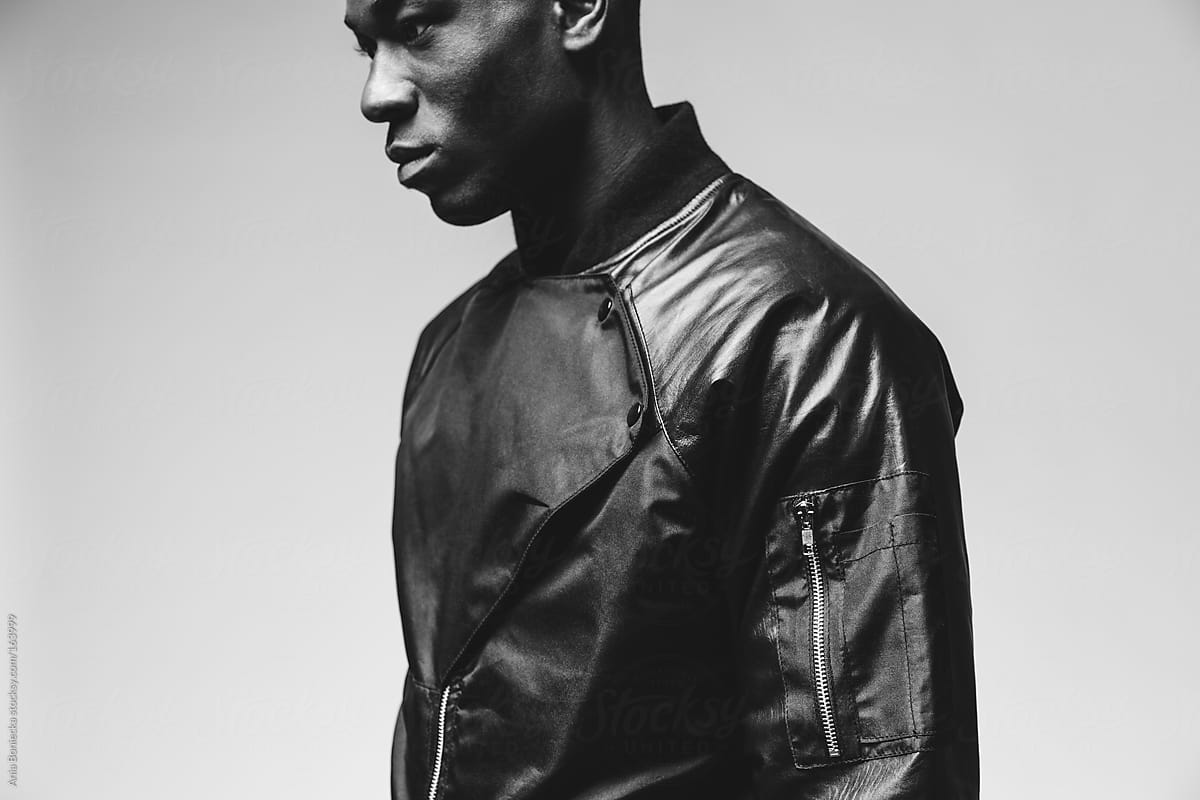 Black & white studio portraits of a fashionable young black man