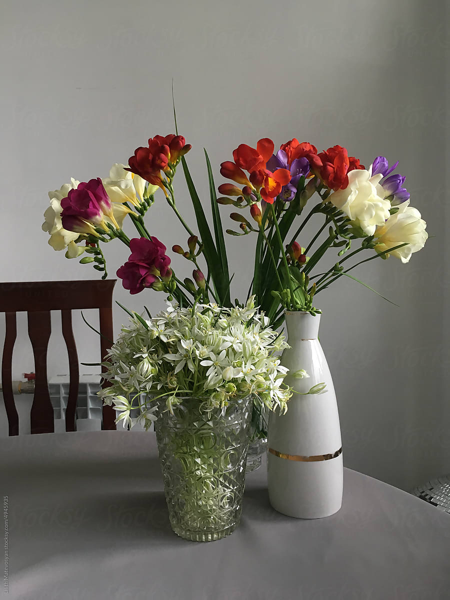 three vases with flowers
