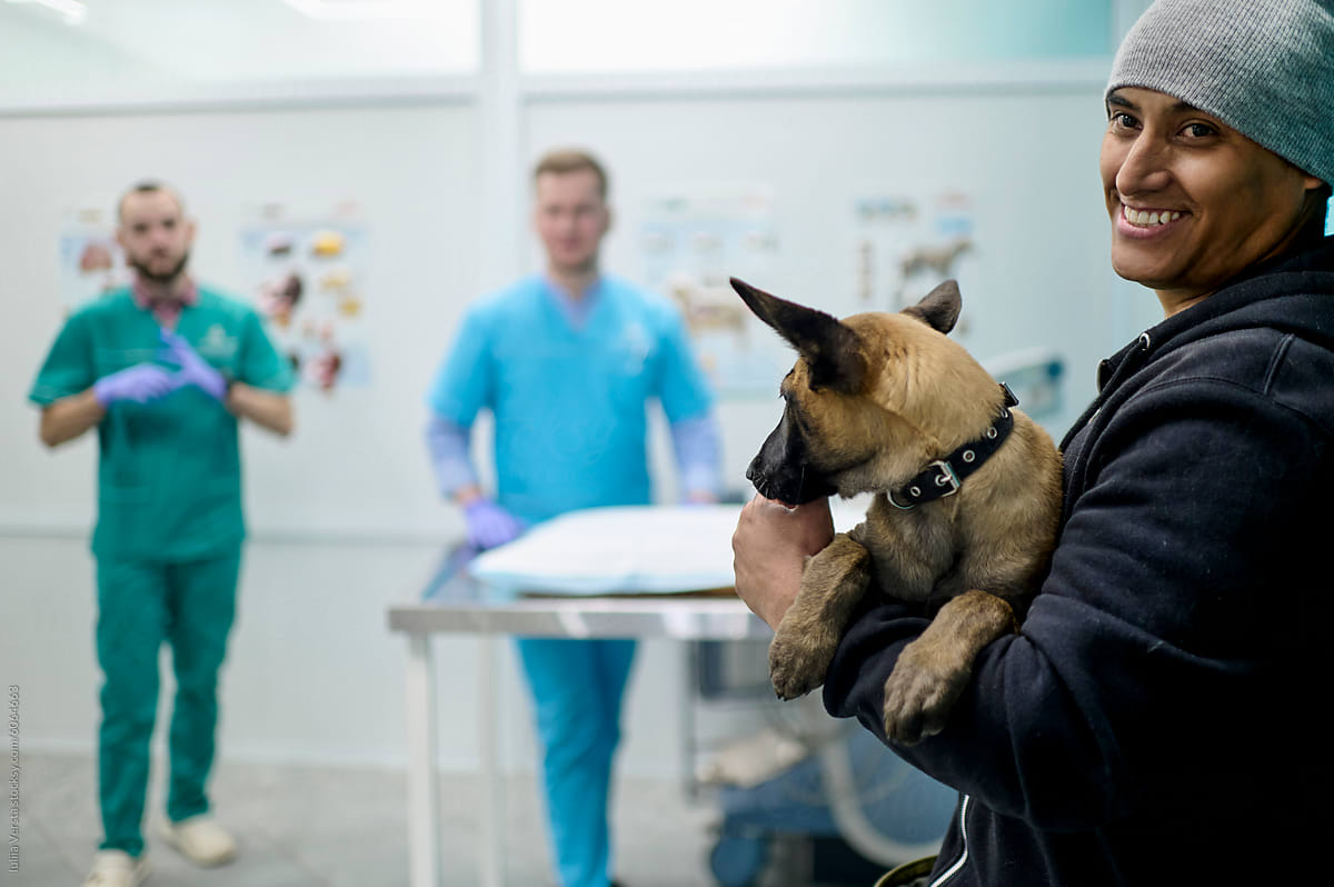 Young man with his dog in a clinic