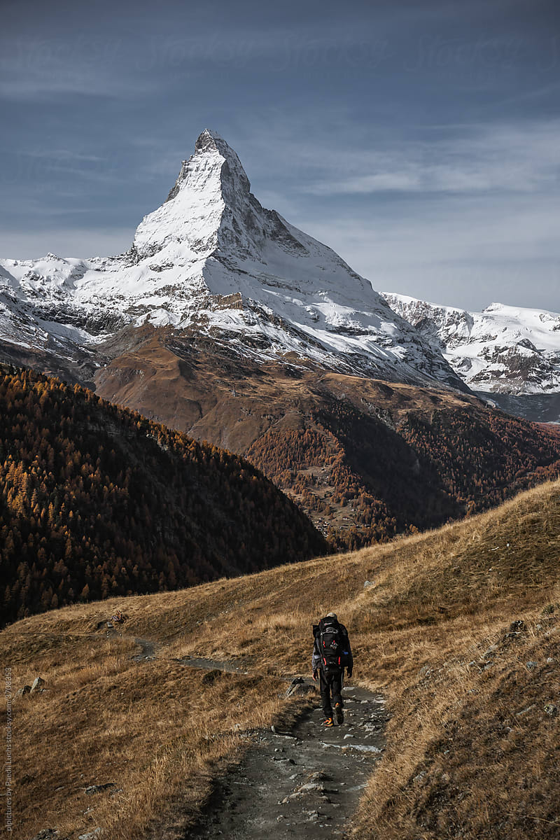 Backpacker in front of the Matterhorn in Zermatt.