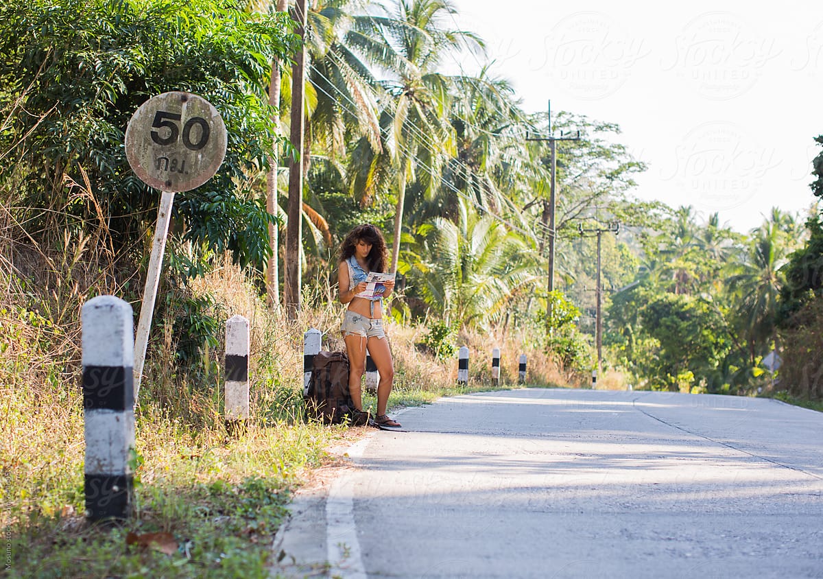 Sexy Female Backpacker Standing On The Road By Stocksy Contributor Mosuno Stocksy 3773