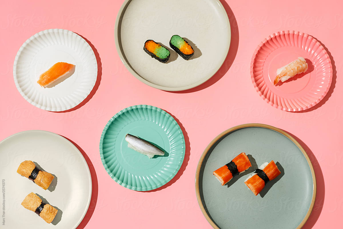 Set of sushi and maki on colorful plate
