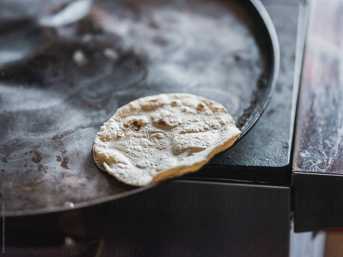 Cooking flour tortillas in a pan.