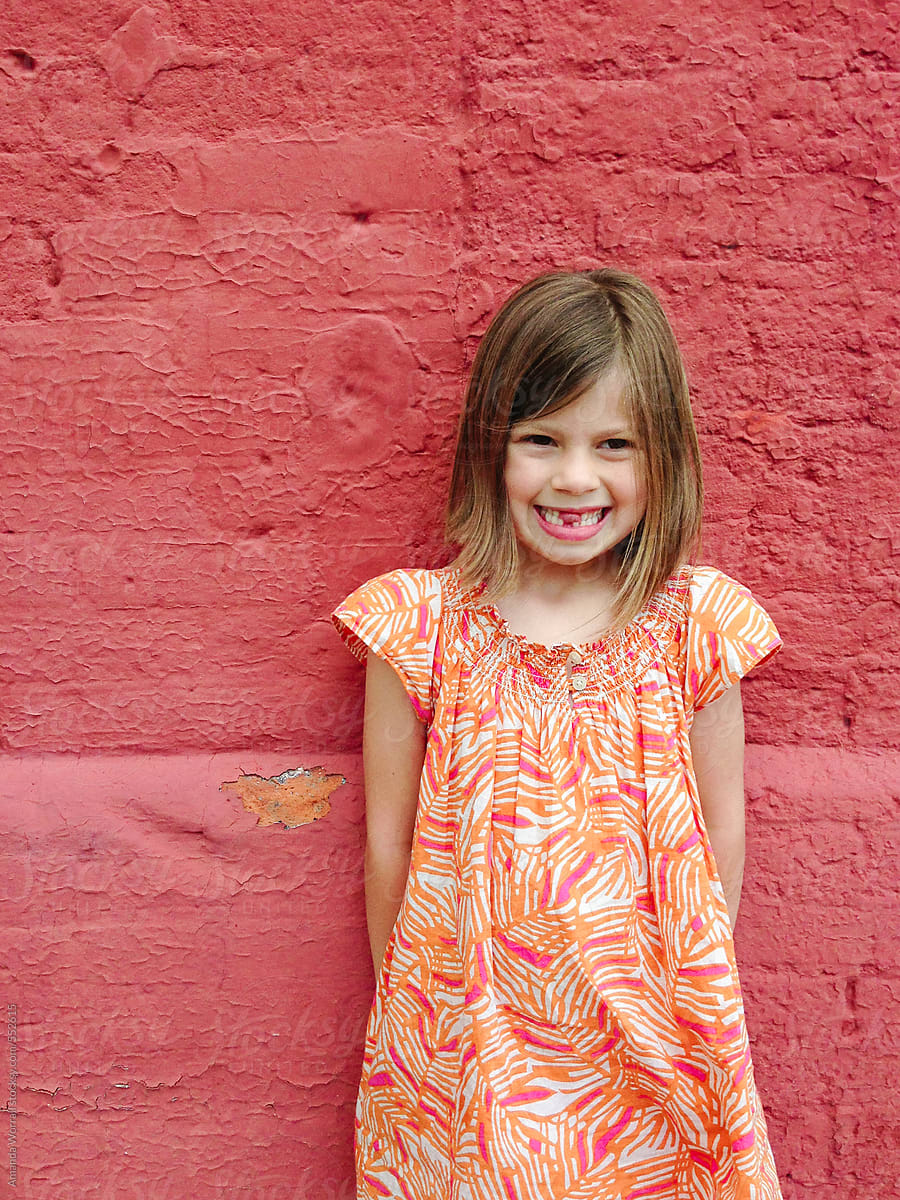 Smiling Girl Sticking Tongue Out Through Her Missing Teeth By Stocksy Contributor Amanda 