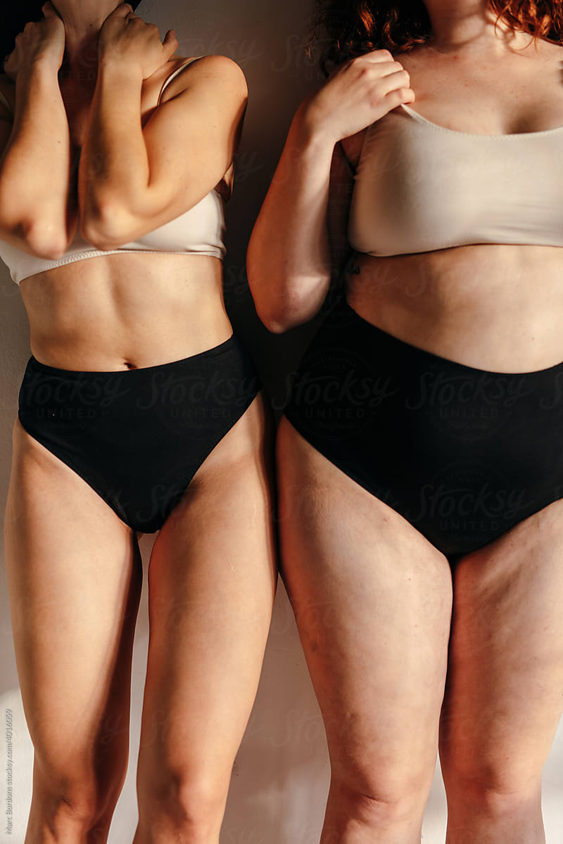 Cropped image of two women with different body type
