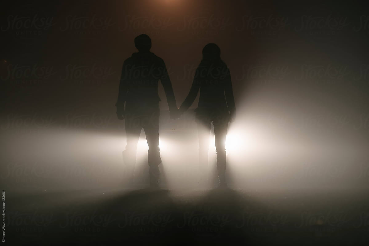 Couple standing in the fog