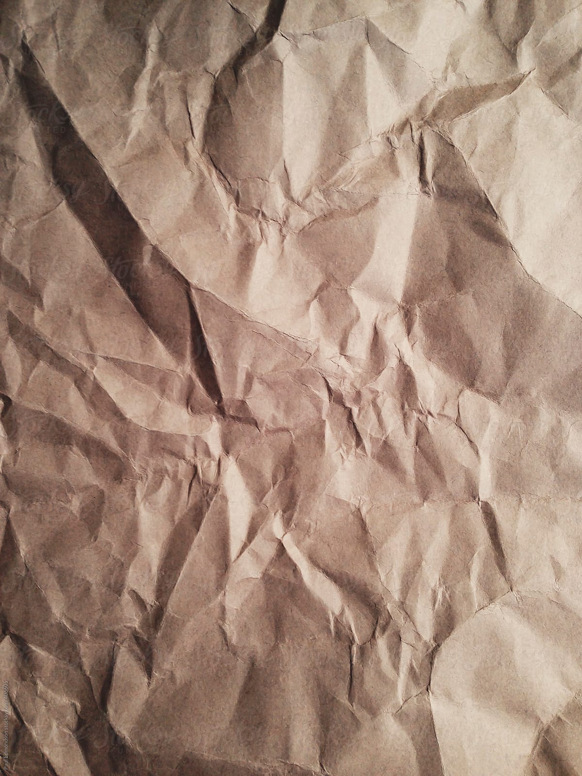 Close Up Of Crumpled Piece Of Construction Paper by Stocksy