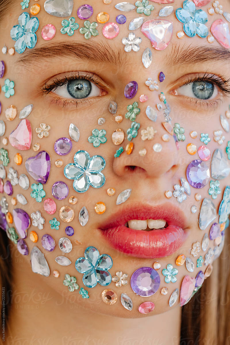 Closeup beauty portrait of face covered with crystals